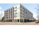 Modern building featuring gray and cream colored brick and large windows, enhanced by a clean, urban landscape at 603 Inca St # 432, Denver, CO 80204