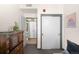 Hallway featuring sliding closet doors, and an open door with a view of the house at 603 Inca St # 432, Denver, CO 80204