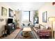 Bright and spacious living room with large windows, comfortable sofas, and stylish decor at 603 Inca St # 432, Denver, CO 80204