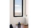 Window view features a cityscape with buildings, mountains, and a partly cloudy sky at 603 Inca St # 432, Denver, CO 80204