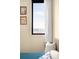 Bright bedroom featuring a window with a view and stylish furnishings at 603 Inca St # 432, Denver, CO 80204