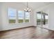 Bright dining area with hardwood floors, large windows and view at 8644 Pennycress Dr, Littleton, CO 80125