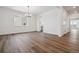 Spacious dining area featuring hardwood flooring and ample natural light from large windows at 8644 Pennycress Dr, Littleton, CO 80125