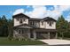 Charming two-story home featuring a covered porch, shake siding, three-car garage and mature landscaping at 8644 Pennycress Dr, Littleton, CO 80125