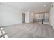 Spacious loft area with neutral-colored carpet and natural light at 8644 Pennycress Dr, Littleton, CO 80125