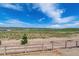 Scenic view of an open landscape from behind a new wooden fence at 8644 Pennycress Dr, Littleton, CO 80125
