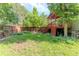 Backyard features a wooden fence, a red deck, and trees at 79 Huron Ct, Boulder, CO 80303