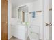 Bathroom featuring a white vanity, a large mirror, and a toilet at 79 Huron Ct, Boulder, CO 80303