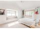 Bright bedroom featuring neutral decor, natural light, a cozy window seat, and carpeted floors at 79 Huron Ct, Boulder, CO 80303