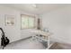 Bedroom features a sleek desk, a guitar, natural lighting, and a ceiling fan at 79 Huron Ct, Boulder, CO 80303