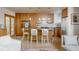 Open-concept kitchen with stainless steel appliances, an island with bar seating, and hardwood floors at 79 Huron Ct, Boulder, CO 80303