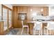 Kitchen boasts a stylish island with bar seating, stainless appliances and hardwood floors at 79 Huron Ct, Boulder, CO 80303