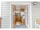 Modern kitchen with stainless steel appliances as seen from the outdoor deck through open french doors at 79 Huron Ct, Boulder, CO 80303