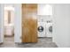 Well lit laundry room featuring a side by side washer and dryer at 79 Huron Ct, Boulder, CO 80303