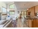 Bright, open-concept living room flows into modern kitchen with bar seating and stainless appliances at 79 Huron Ct, Boulder, CO 80303