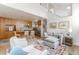 Spacious living room flows into the modern kitchen with bar seating, stainless appliances, and lots of natural light at 79 Huron Ct, Boulder, CO 80303