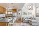 Bright living room and kitchen with modern décor, hardwood floors, and stainless steel appliances at 79 Huron Ct, Boulder, CO 80303