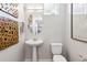 Stylish half bathroom featuring modern fixtures, chic decor, and clean lines at 1356 S Boston Ct # A, Denver, CO 80247