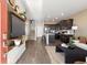 Bright, open-concept living area with modern decor, hardwood floors, and a stylish island kitchen at 1356 S Boston Ct # A, Denver, CO 80247
