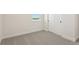 Carpeted bedroom with bright white walls, a window with blinds, and a closet for storage at 42998 Colonial Trl, Elizabeth, CO 80107