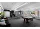 Spacious game room includes pool table, ping pong, and comfortable seating at 555 E 10Th Ave # 15, Denver, CO 80203