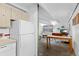 Partial view of kitchen and living room, showing open space with appliances at 555 E 10Th Ave # 15, Denver, CO 80203