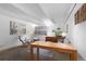 Comfortable living area with natural light, beamed ceiling and a functional layout at 555 E 10Th Ave # 15, Denver, CO 80203