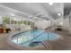 Indoor swimming pool area featuring lots of natural lighting and multiple tables at 555 E 10Th Ave # 15, Denver, CO 80203