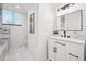 Elegant bathroom with marble tile and modern vanity at 6675 S Apache Dr, Littleton, CO 80120