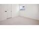 Well-lit bedroom with neutral walls and carpet flooring at 6675 S Apache Dr, Littleton, CO 80120