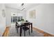 Dining room with hardwood floors, a table for four, and access to the backyard at 6675 S Apache Dr, Littleton, CO 80120