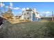 Gray house exterior, landscaped yard, and wooden fence at 6675 S Apache Dr, Littleton, CO 80120