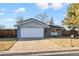 Newly painted house with a two-car garage at 6675 S Apache Dr, Littleton, CO 80120