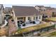 Aerial view of a well-maintained lawn, patio set, and outdoor grill, perfect for entertaining guests at 10256 Olathe Way, Commerce City, CO 80022