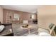 Living room featuring a brown couch, coffee table, and two armchairs at 8081 Johnson St, Arvada, CO 80005