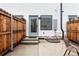 A cozy patio space with a wooden fence providing privacy and an outdoor seating arrangement at 1308 Stuart St, Denver, CO 80204