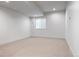 Unfurnished basement room with recessed lighting, neutral carpet, and a window at 1308 Stuart St, Denver, CO 80204