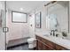 Well-appointed bathroom featuring a glass-enclosed shower, modern fixtures, and vanity at 1308 Stuart St, Denver, CO 80204