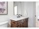 Beautiful bathroom showcasing a wood vanity, modern fixtures, and bright lighting at 1308 Stuart St, Denver, CO 80204