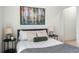 Comfortable bedroom showcasing bedside tables, lamps, and modern art at 1308 Stuart St, Denver, CO 80204