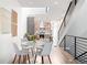 Inviting dining area with a modern table and views of the stylish, open-concept kitchen at 1308 Stuart St, Denver, CO 80204