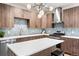 Contemporary kitchen with stainless steel appliances, stylish island, and pendant lighting at 1308 Stuart St, Denver, CO 80204
