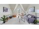 Bright living room with vaulted ceilings, cozy seating, and a modern decorative style at 1308 Stuart St, Denver, CO 80204