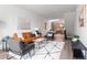 Open-concept living room features stylish decor, comfortable seating, and an open view to the kitchen at 1308 Stuart St, Denver, CO 80204