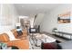 Bright and open living space with a staircase, modern lighting, and seamless flow into the adjacent kitchen at 1308 Stuart St, Denver, CO 80204