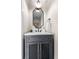 Stylish powder room with modern vanity, decorative mirror, and elegant fixtures at 1308 Stuart St, Denver, CO 80204
