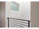 Modern staircase with sleek railing and bright natural light from large window at 1308 Stuart St, Denver, CO 80204