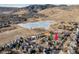 Lovely aerial view of the community featuring a community lake and beautiful mountain views at 780 Utica Ave, Boulder, CO 80304