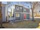 Charming two-story gray home with a red front door and well-maintained landscaping at 780 Utica Ave, Boulder, CO 80304
