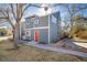 Charming exterior of a gray two-story home with a red front door and well-maintained landscaping at 780 Utica Ave, Boulder, CO 80304